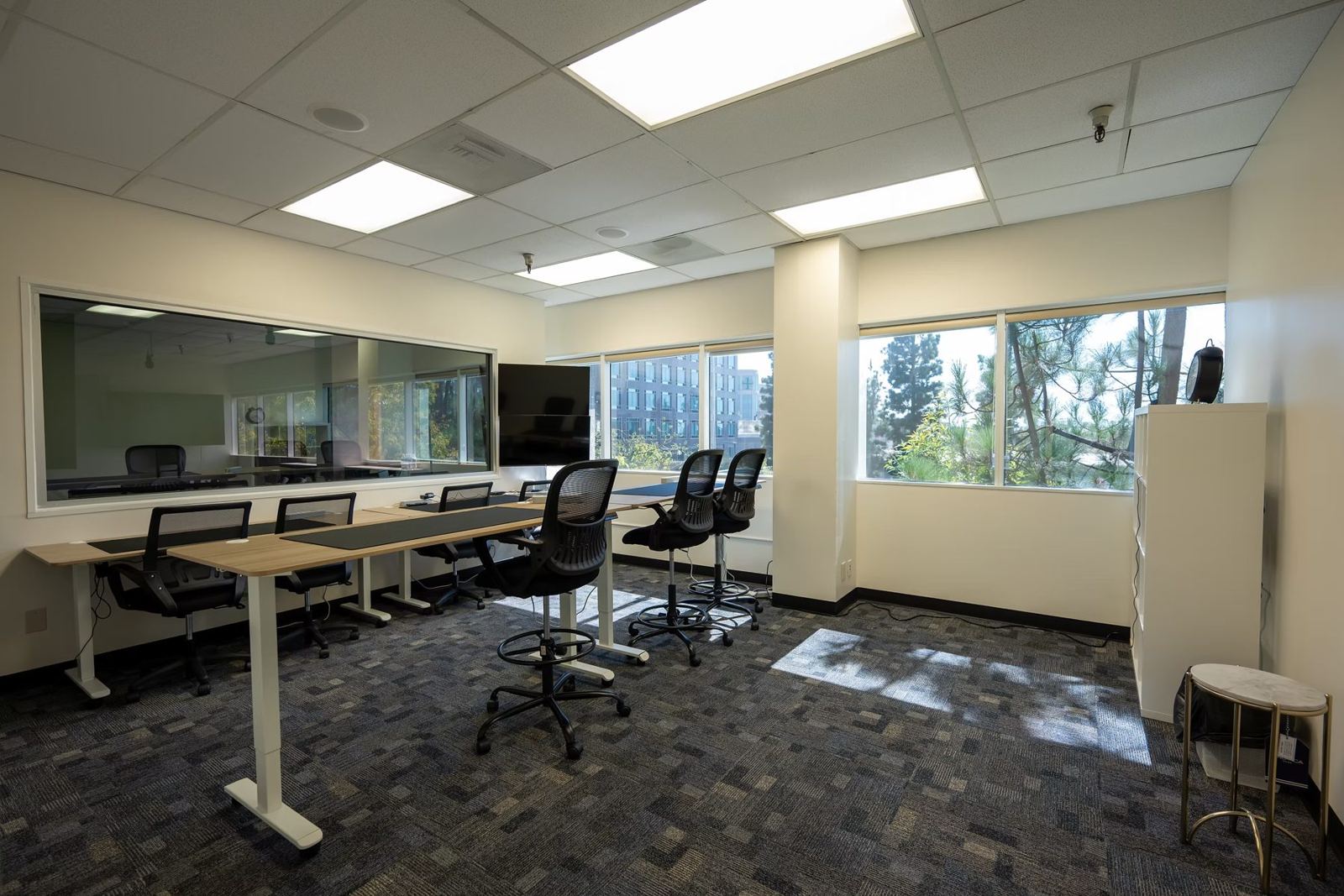 Viewing room desks along the window